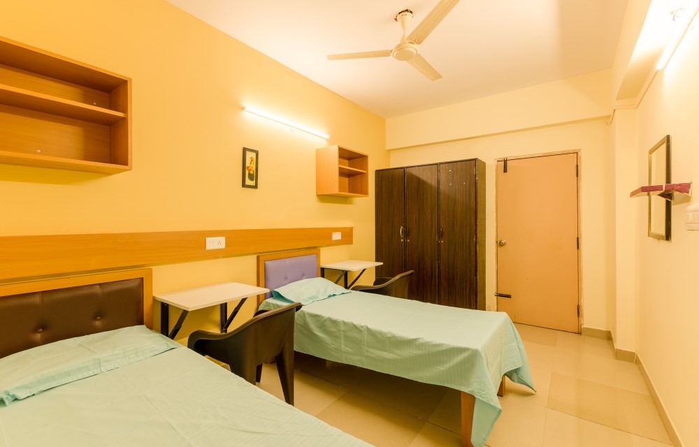 Spacious premium room with modern interiors at Pelagia Paradise PG